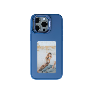 Reflekt™ blue E-Ink smart case for iPhone 15 showing a personalized photo of a couple on the back display.